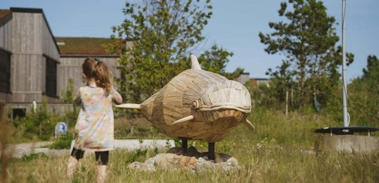 Træskulptur som forestiller marsvin i Kanalbyen